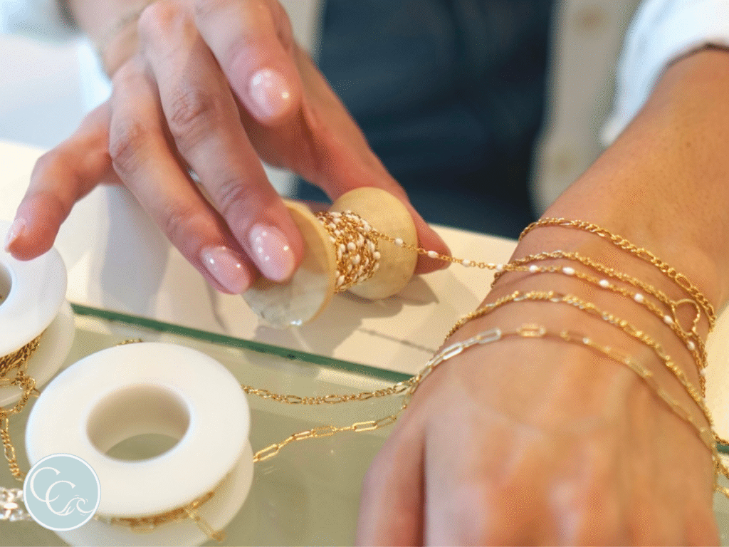 Woman getting a welded bracelet at a Coastal Chains event in Charleston, SC